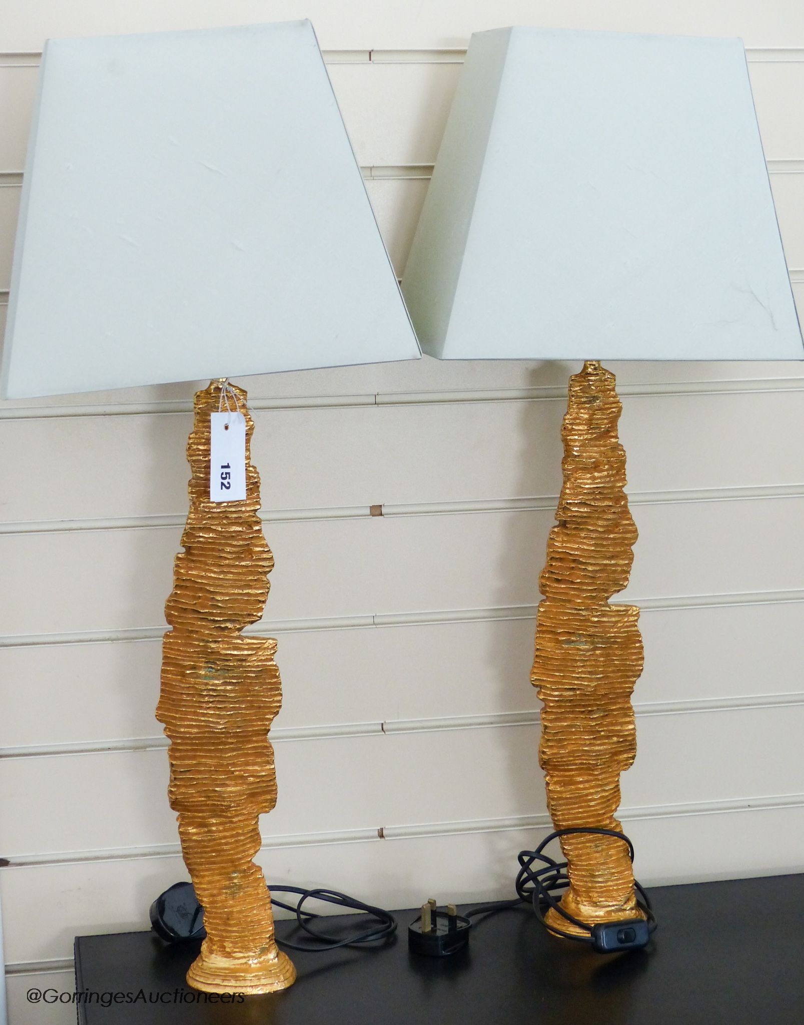 A pair of Galerneau, Paris gilt bronze sculptural lamps, 51.5 cm high to fitting, eau de nil silk shades